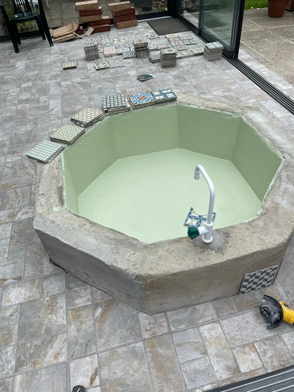 Bathroom fixtures and bespoke tiling shown from an angle