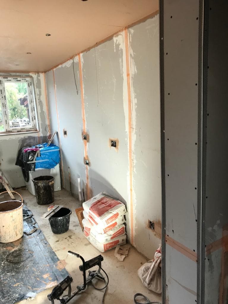 Large room with freshly plastered walls and clean finish