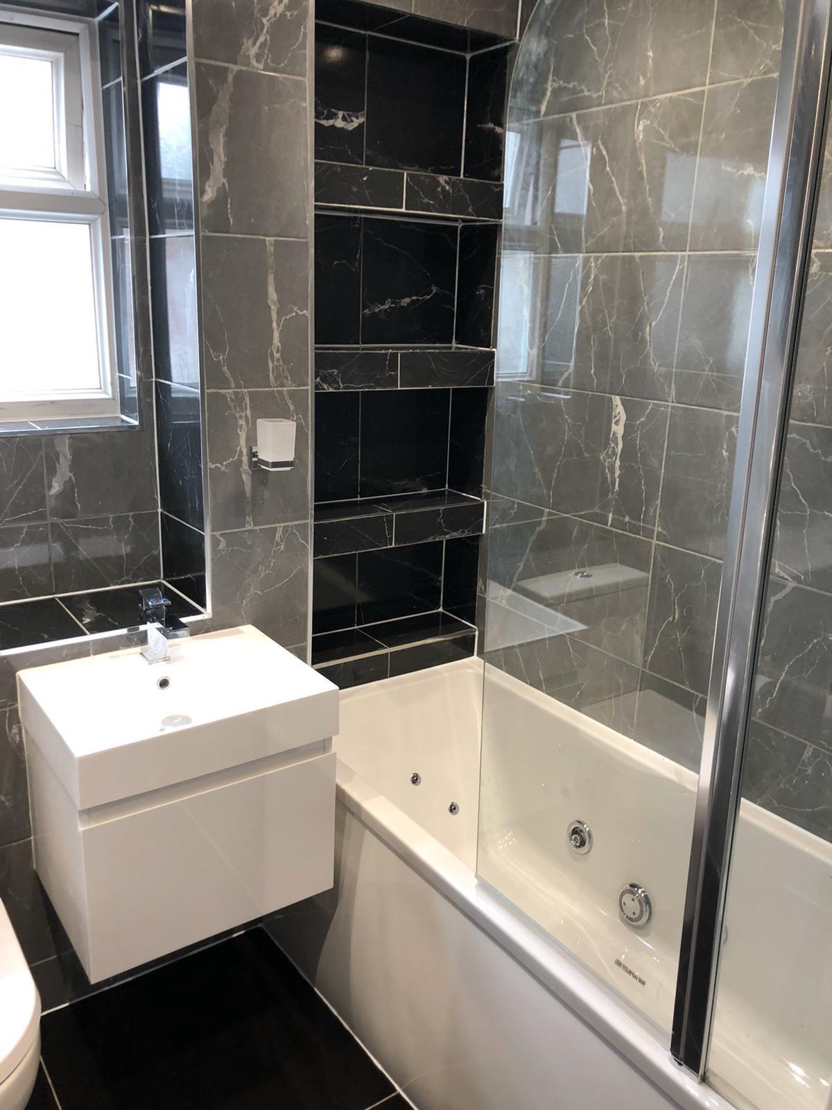 Completed bathroom renovation with tiling
